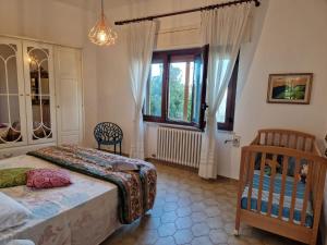 Postel nebo postele na pokoji v ubytování VILLA TERESA IRIS e Villa Teresa ibisco + 47 fotografií