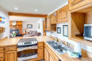 a kitchen with a sink and a stove at Timber Ridge 203 in Silverthorne