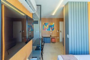 a room with a bed and a table in a room at Allure Residence by Carpediem in Recife