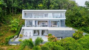 an aerial view of a house at Yamu Hills Panoramic Ocean View 6 Bed Luxury Vila in Phuket Town