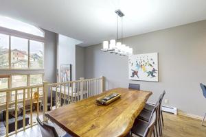 a dining room with a wooden table and chairs at Ironwood 16 in Steamboat Springs