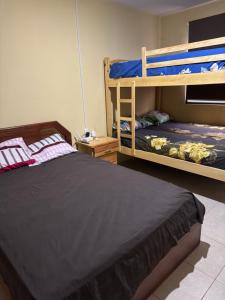 Ένα ή περισσότερα κρεβάτια σε δωμάτιο στο Apartamento vacacional con playa privada