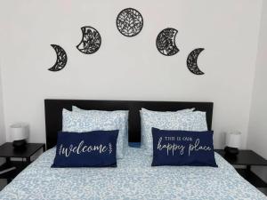 a bedroom with a bed with two pillows and a heart at Bright apartment in the heart of Chimay, 40 m² with view in Chimay