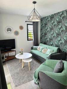 Istumisnurk majutusasutuses Villa charmante avec piscine à Piton Saint-Leu, 120 m²