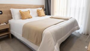 Postel nebo postele na pokoji v ubytování RM Campana Hotel