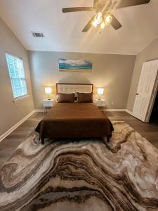 a bedroom with a bed with a large rug at Your Quiet Escape in Locust Grove Sleeps 6 in Locust Grove