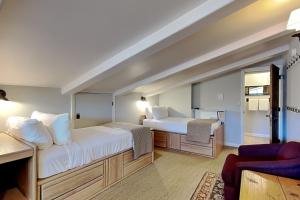 a hotel room with two beds and a couch at Timberline Condominiums 2 Bedroom plus Loft 3 Bath Deluxe Unit D3D in Snowmass Village
