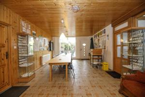 a large room with a table and a wooden ceiling at Studio Glass Vysočina in Škrdlovice +43 photos