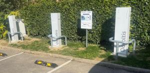 a row of parking signs in front of a hedge at Hôtel Kyriad Epernay en Champagne in Épernay +52 photos