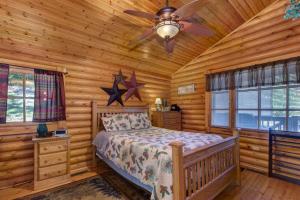 a bedroom with a bed in a log cabin at Unforgettable Dreams By Avada Properties in Catlettsburg +46 photos
