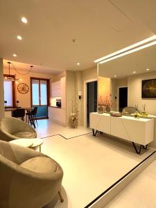 a living room with a couch and chairs and a table at Salotto Santa Franca in Piacenza