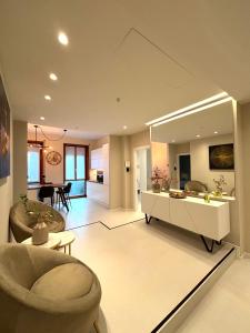 a living room with a couch and a large mirror at Salotto Santa Franca in Piacenza