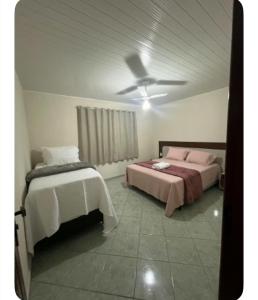 Postel nebo postele na pokoji v ubytování Casa Recanto da Montanha + 14 fotografií