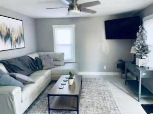 a living room with a couch and a coffee table at Morgantown Lux Retreat, Short walk to WVU Stadium in Morgantown