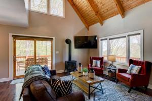 a living room with a couch and a table at Sugar Rush in Sugar Mountain