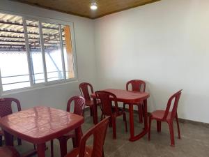 a room with two tables and chairs and a window at Begonia Homestay Darjeeling in Darjeeling +58 photos