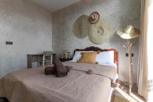 Postel nebo postele na pokoji v ubytování Hey Ola Surf House & Hostel