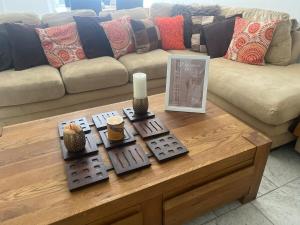 a living room with a couch and a coffee table at The Spacious Stay Stratford in London +52 photos