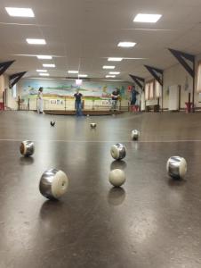 a group of balls on the floor of a bowling alley at Naturellement Loire ! in Saint-Martin-de-la-Place +9 photos