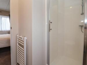an open door to a room with a bed at Meadows Park 4 in Hull