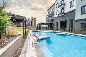 a swimming pool in the middle of a building at Landing Apartments - Phoenix Warehouse District in Phoenix