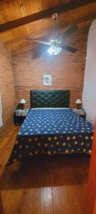 Postel nebo postele na pokoji v ubytování Cabañas Los Cerezos