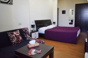 Ένα ή περισσότερα κρεβάτια σε δωμάτιο στο Hotel Grig