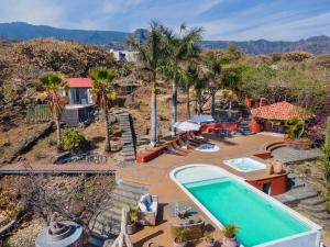 an aerial view of a house with a swimming pool at Private 5-Bedroom Compound with Pool Tepoztlán Retreat in Tepoztlán