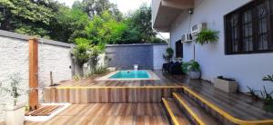 a patio with a swimming pool in a house at Hotel Mola in Puerto Iguazú