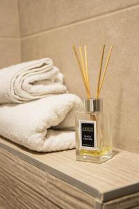 a bottle of absolut perfume sitting on a table at VujSki - Gondola Apartman in Brzeće +31 photos