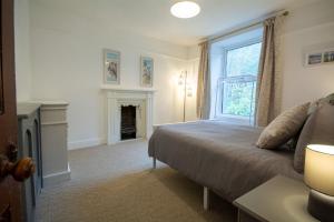 Ένα ή περισσότερα κρεβάτια σε δωμάτιο στο Lleust