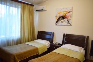 Postel nebo postele na pokoji v ubytování Hotel Grig