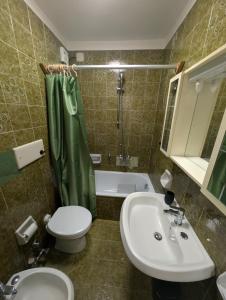 a bathroom with a sink and a toilet and a shower at Natalia in Sauze d'Oulx