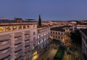 an aerial view of a city at night at Hotel Kraft in Florence