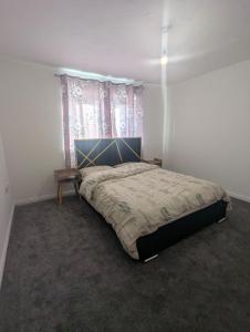 Postel nebo postele na pokoji v ubytování 3SIEE Homes + 4 fotografie