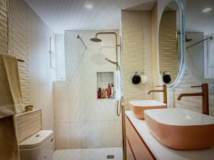 a bathroom with a tub and a sink and a shower at Malaga entire rental unit in Málaga +16 photos