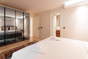 a bedroom with a bed and a large mirror at ares yalıkavak in Bodrum City +19 photos