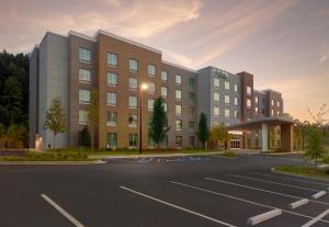 a parking lot in front of a building at Fairfield by Marriott Inn & Suites Alpharetta Avalon Area in Alpharetta