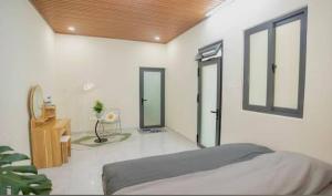 Postel nebo postele na pokoji v ubytování Amy Hotel & Apartment