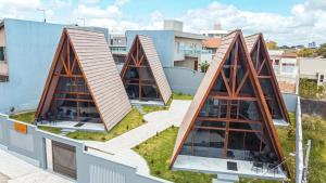 an overhead view of a building with triangular roofs at Cabanas Vovó Tezinha in Bananeiras
