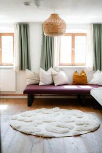 En eller flere senge i et værelse på Alima der Hof - Apartment Mühlhans