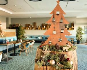 a christmas tree in the lobby of a hotel at SeeHuus Lifestyle Hotel in Timmendorfer Strand
