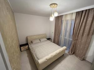 Ένα ή περισσότερα κρεβάτια σε δωμάτιο στο Urban Escape Craiova