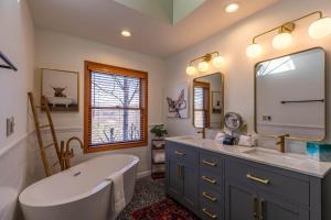 a bathroom with a tub and a large mirror at The Raven in Beech Mountain +67 photos