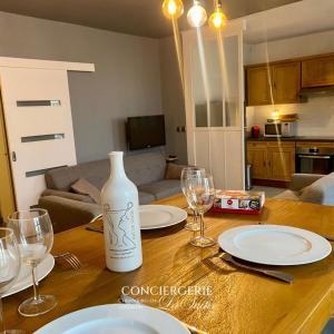 a table with plates and wine glasses on top of it at La Passerelle in Cherbourg en Cotentin +6 photos