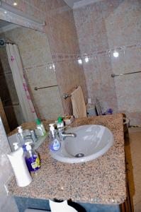 a bathroom with a sink and a shower at appartement el harti in Oulad Akkou