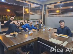 a group of people sitting at a table at Hotel Kendari - Chincha in Chincha