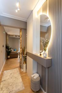 a bathroom with a sink and a mirror on the wall at Kaltak Luxury Stay in Bar