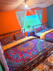 Postel nebo postele na pokoji v ubytování Cà's Garden