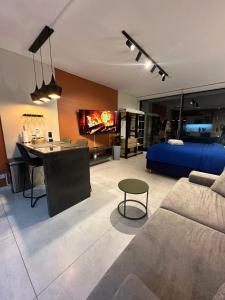 a living room with a couch and a bed at Foster Studio - Park 3 in Buenos Aires